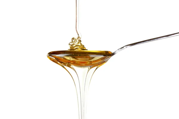 Deilig honning i skje – stockfoto