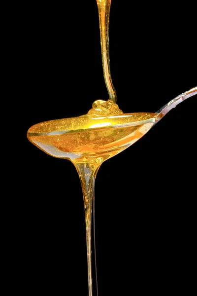 Sabrosa miel en cuchara — Foto de Stock