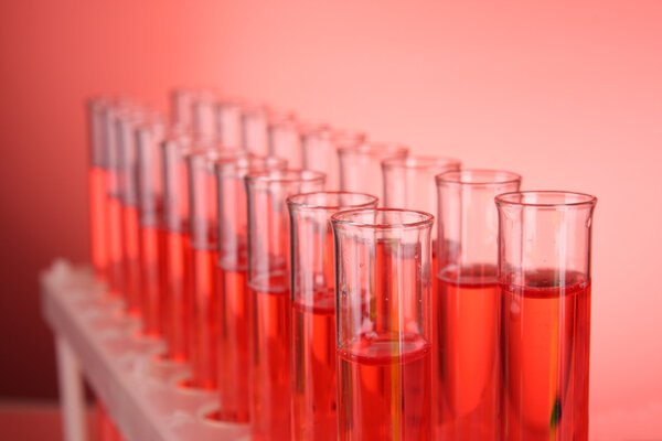 Test-tubes on red background