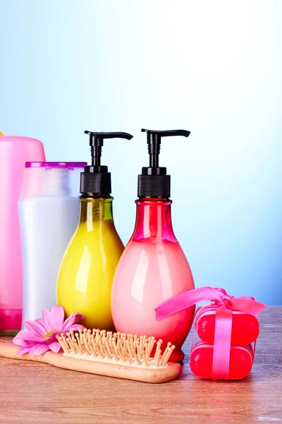 A set of bath cosmetics on blue background — Stock Photo, Image