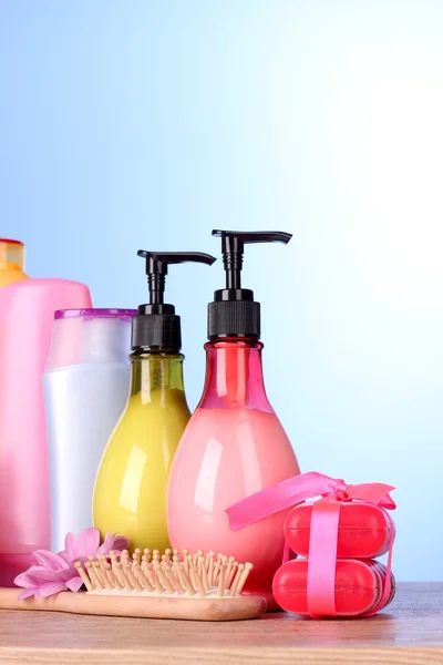 A set of bath cosmetics on blue background — Stock Photo, Image