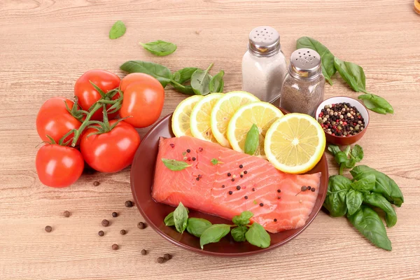 Red fish, lemon, pepper and tomato — Stock Photo, Image