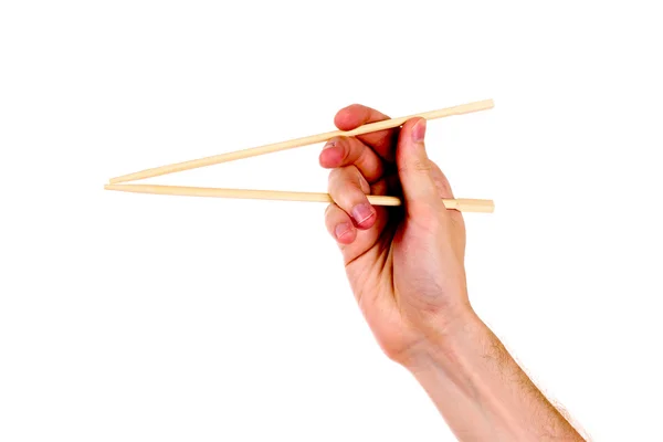 Woman's hand and wooden chopsticks — Stock Photo, Image