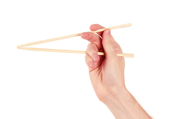 Γυναικείο χέρι και ξύλινων chopsticks — Φωτογραφία Αρχείου