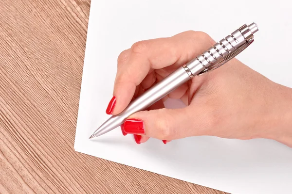Woman's hand, pen and paper — Stock Photo, Image