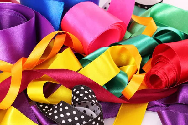 Many beautiful bright satin ribbons — Stock Photo, Image