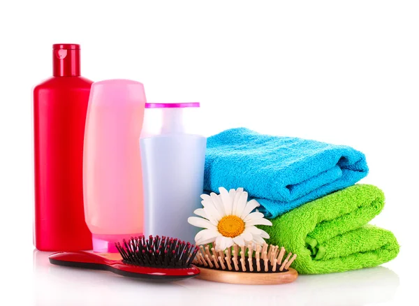 Shampoo bottles and hair brush on white Stock Picture