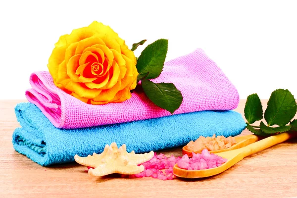 Rose petals, bath salt and towel Royalty Free Stock Images