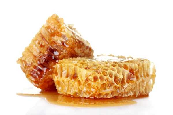 Peines con miel aislados en blanco Imágenes de stock libres de derechos