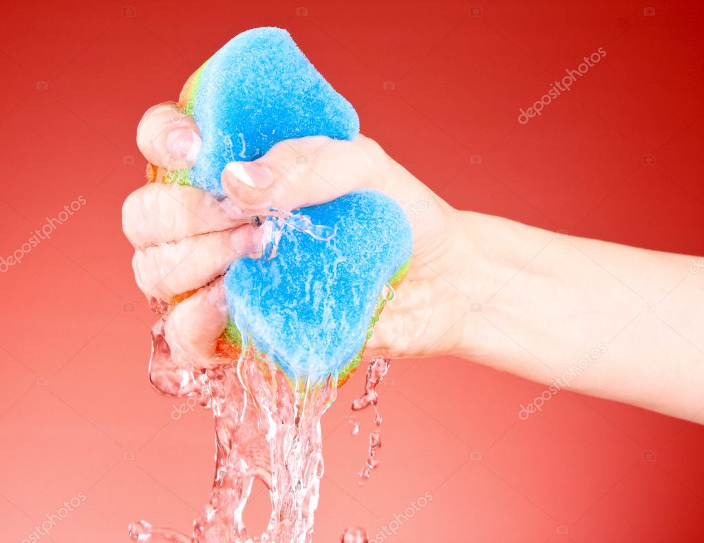 Squeezing sponge on background — Stock Photo © belchonock 6796634