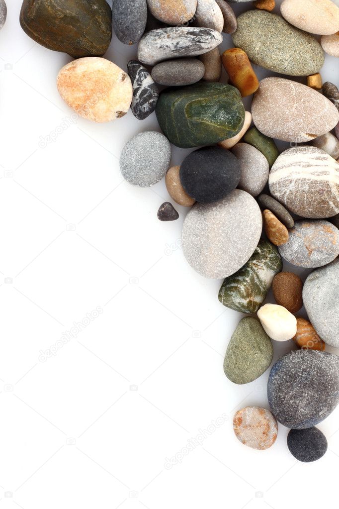 Round pebble stones isolated on white