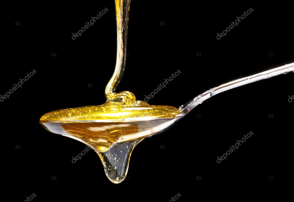 Tasty honey in spoon — Stock Photo, Image