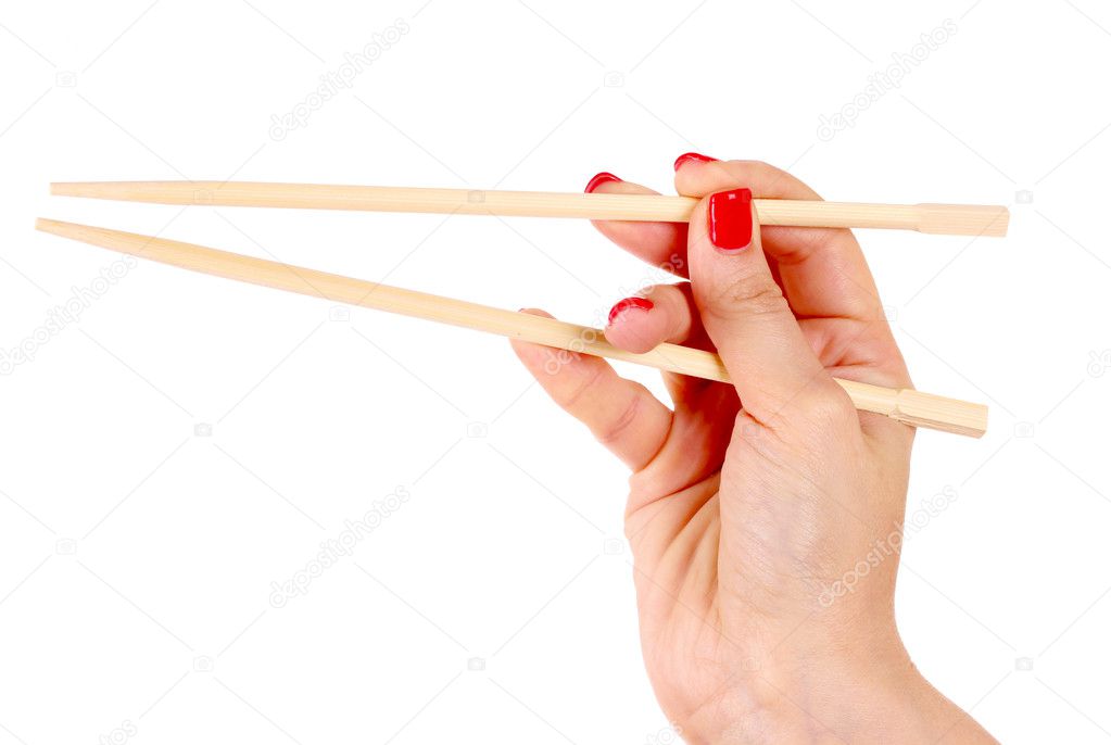 Woman's hand and wooden chopsticks