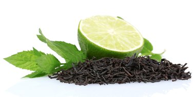 Dry black tea leaves, lime and mint clipart