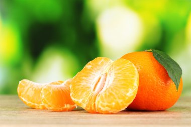 Juicy ripe tangerines with cloves clipart