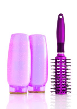 Shampoo bottles and hair brush on white clipart