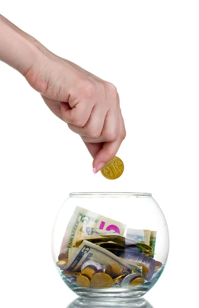 Glass bank for tips with money and hand isolated on white. Ukrai — Stock Photo, Image