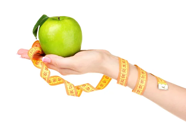 Woman hand with apple and measuring tape — Stock Photo, Image
