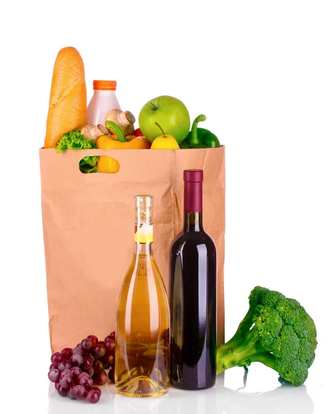Vegetables and wine in a paper bag — Stock Photo, Image