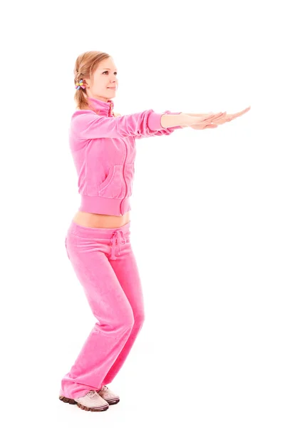 Genç kadın üzerinde beyaz izole egzersiz yaparak — Stok fotoğraf