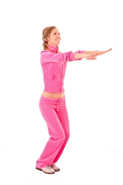 Mujer joven haciendo ejercicio aislado en blanco — Foto de Stock
