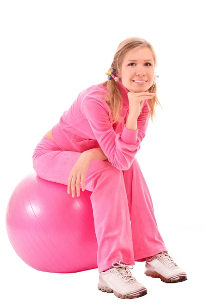 Жінка з м'ячем для вправ ізольована на білому — стокове фото
