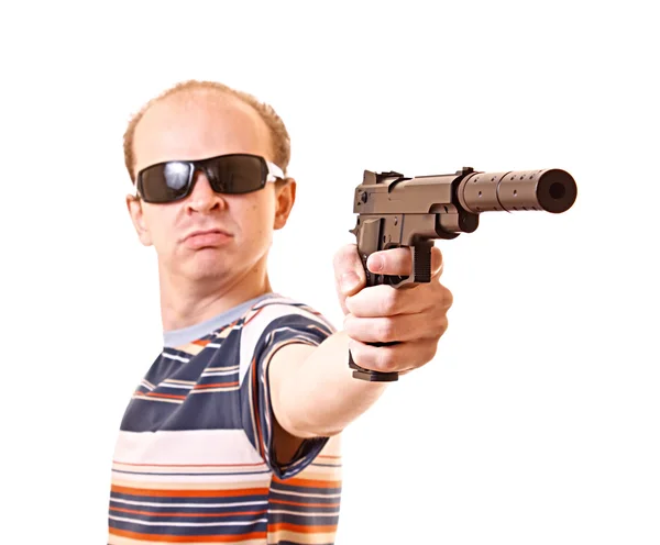 Молодий чоловік з пістолетом ізольований — стокове фото