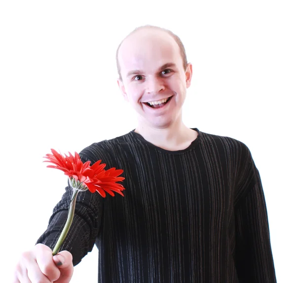 Młody człowiek bardzo szczęśliwy z kwiatem — Zdjęcie stockowe
