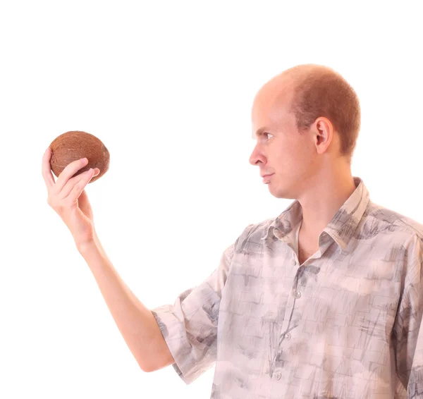 Молодой человек с кокосом изолирован на белом — стоковое фото