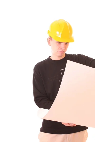 Jeune homme avec du papier en casque jaune isolé sur blanc — Photo