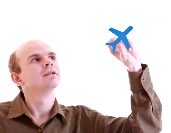 Uomo con piccoli aerei in mani isolate su bianco — Foto Stock