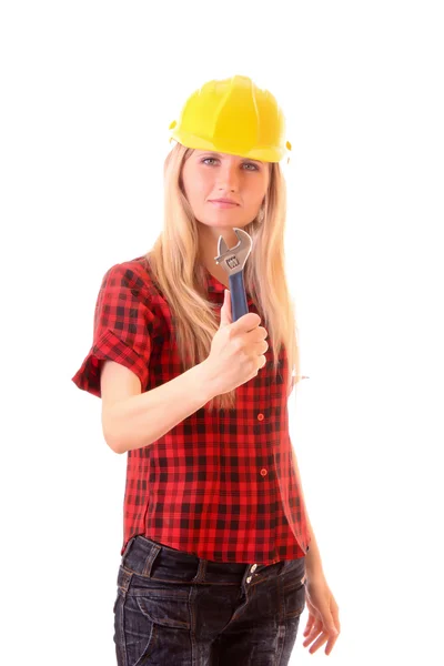 Junge Frau im Helm mit verstellbarem Schraubenschlüssel isoliert auf weiß — Stockfoto