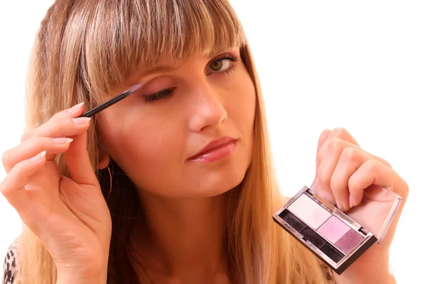Jonge vrouw haar geïsoleerd op witte wenkbrauw make-up — Stockfoto