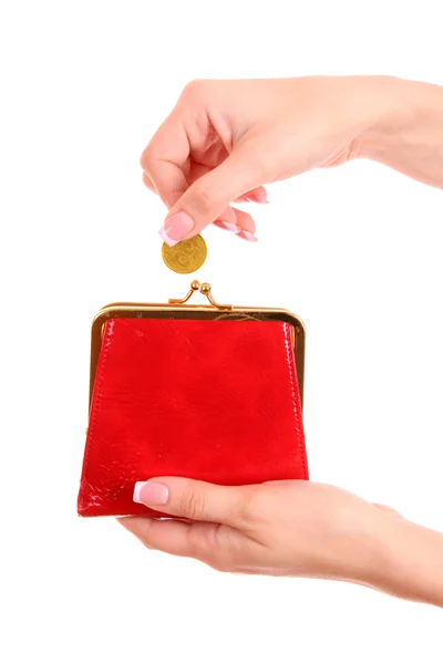 Monedero rojo y moneda en la mano de mujer sobre fondo blanco — Foto de Stock