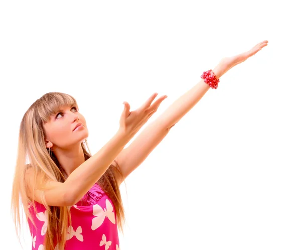Ung kvinna som pekar på något isolerat på vit — Stockfoto