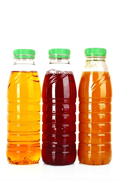 Bottles of juice on a white background — Stock Photo, Image