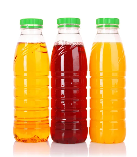 Botellas de jugo sobre un fondo blanco — Foto de Stock