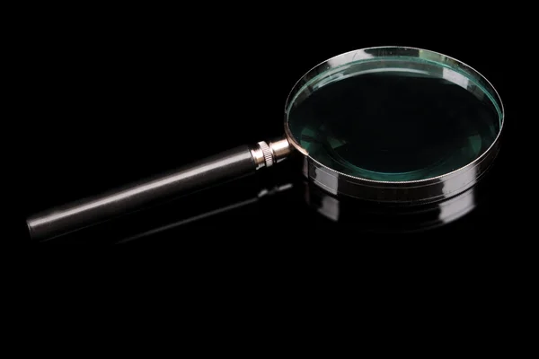 Magnifying glass on a black background — Stock Photo, Image