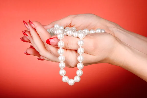 Beads in hand Stock Image