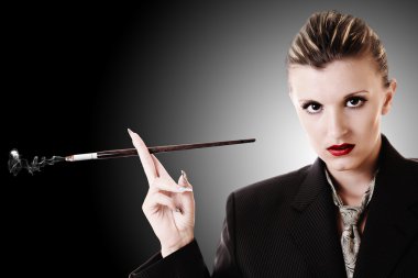 Woman with cigarette holder in office suite clipart