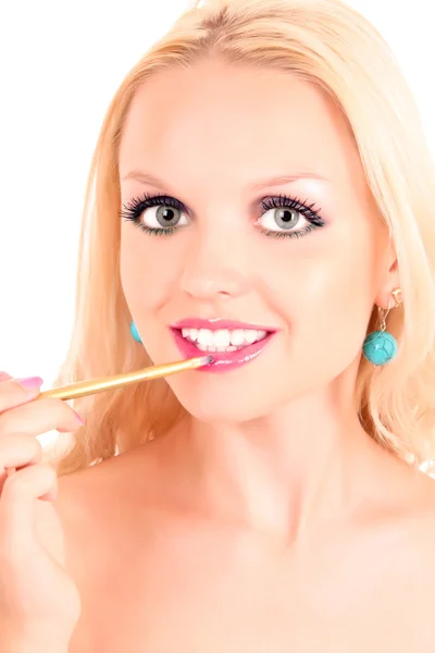Mladá žena make-up izolovaných na bílém — Stock fotografie