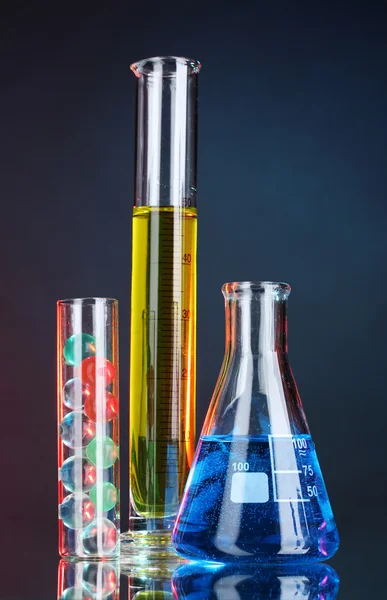 Test-tubes on blue-red background — Stock Photo, Image