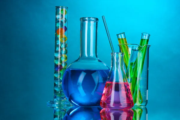 Test-tubes on blue background — Stock Photo, Image