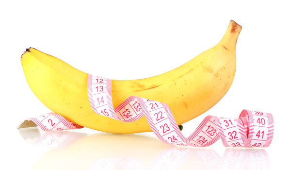Ripe banana and measuring tape isolated on white