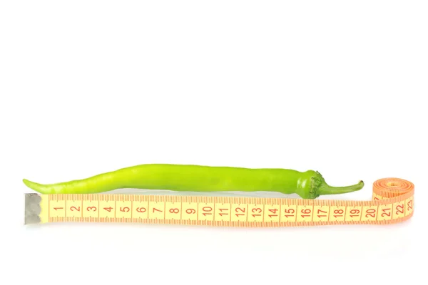 Green hot pepper with measuring tape isolated on white — Stock Photo, Image