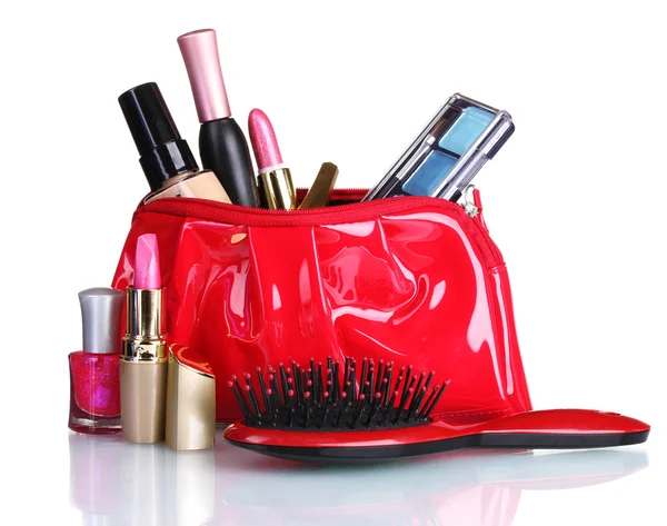 Beautiful red makeup bag and cosmetics isolated on white