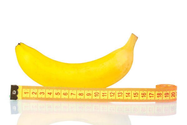 Ripe banana and measuring tape isolated on white