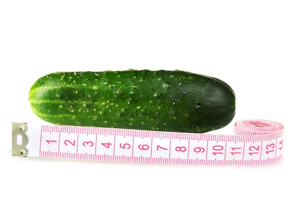 stock image Cucumber with measuring tape isolated on white