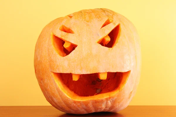 Stock image Pumpkin in hat on yellow