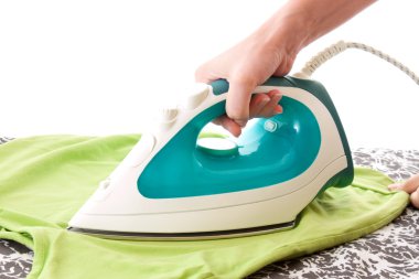 A woman ironing a t-shirt clipart